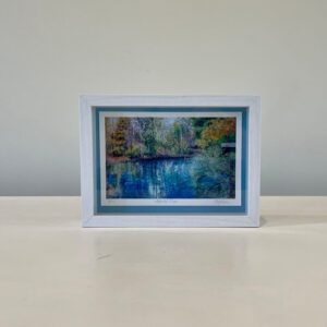 Available, July 2025. A picture of a lake in a white frame.