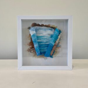 Available, July 2025. A white frame with a blue and white painting on it.